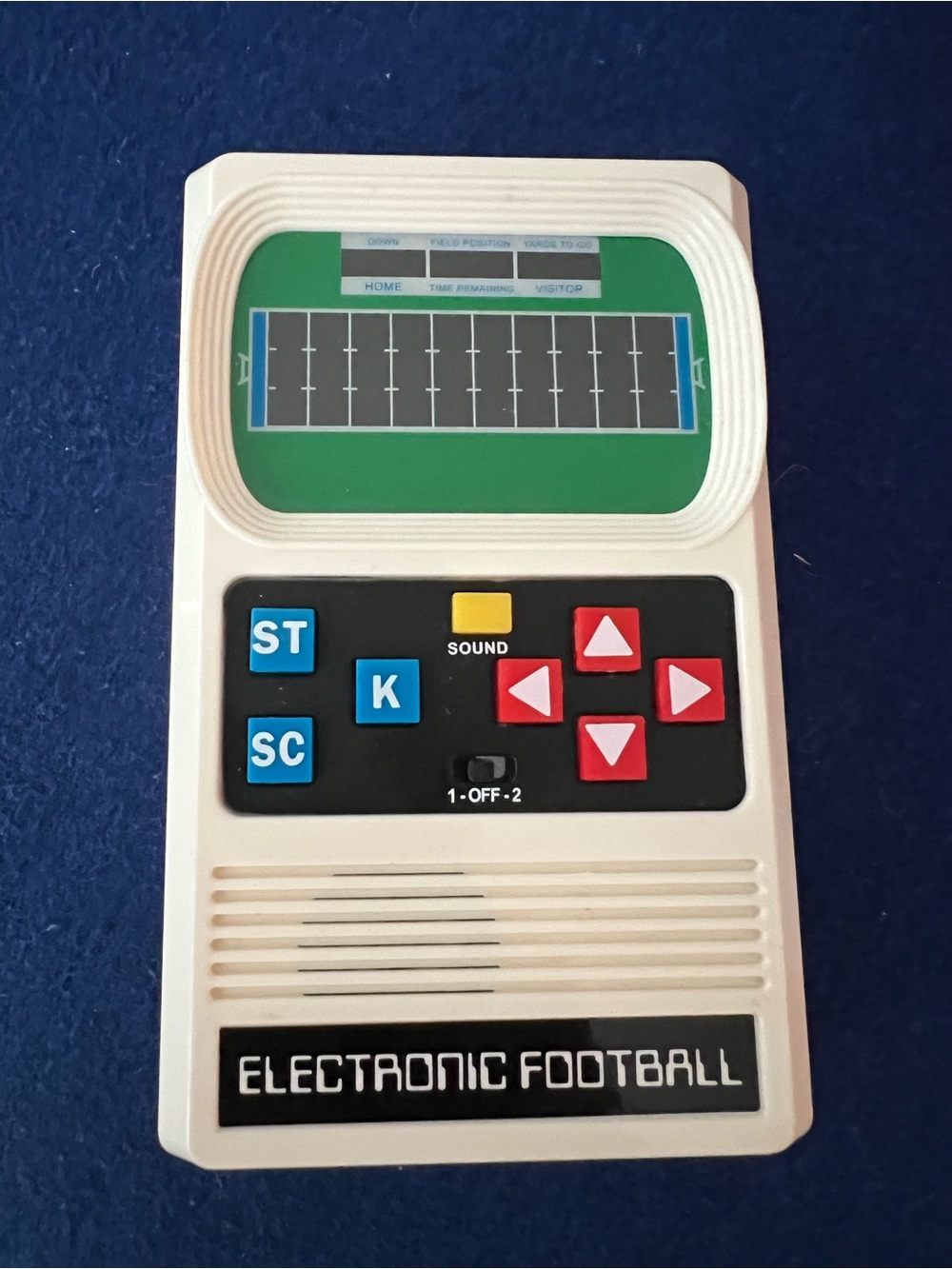 Mattel Electronic Football Handheld Game in White with Red and Blue Buttons